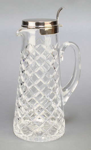 A cut glass lemonade jug with Sterling silver lid 7 1/2" 