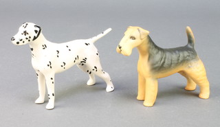 A Beswick figure of a standing Dalmatian 5", a ditto matt figure of a Wire Haired Terrier 4" 