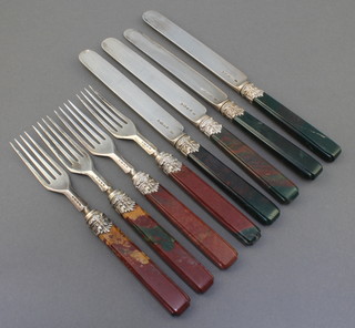 Four Victorian silver knives and forks with hard stone handles London 1848