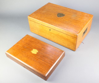 An Edwardian oak canteen with fitted trays, a mahogany ditto 
