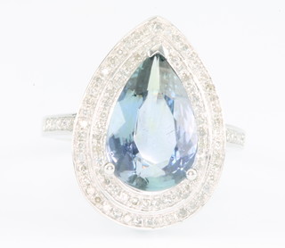 A 14ct white gold pear shaped tanzanite and diamond ring, the centre stone approximately 3.84ct surrounded by 2 rows of brilliant cut diamonds approx. 0.8ct, size N