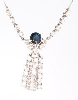 An Art Deco style sapphire and diamond drop pendant, the sapphire approx 2.5ct with brilliant and baguette cut diamonds approx. 2ct on an 18ct white gold chain