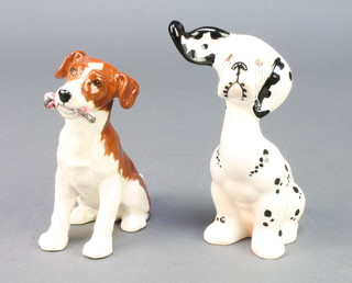 A Beswick figure of a seated puppy holding a toy 4", a ditto of a Dalmatian puppy 4 1/2" 