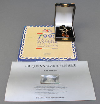 A pair of silver and amber earrings, 2 rings, an uncirculated coin set and a ditto silver stamp 