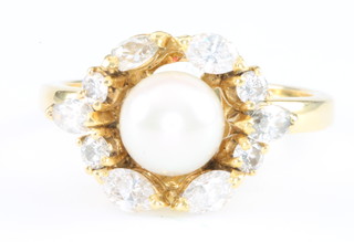 An 18ct yellow gold open pearl and diamond dress ring, size N