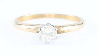 A 14ct yellow gold single stone brilliant cut diamond ring, size K 1/2 