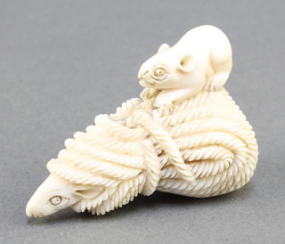 A Japanese carved ivory Netsuke in the form of a mouse hiding in a bundle of rope with another mouse sitting on top, signed 1 1/2" 