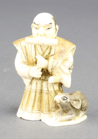 A Meiji period Japanese carved ivory Netsuke in the form of a standing Samurai with a giant mouse at his feet, signed 2 1/4" 