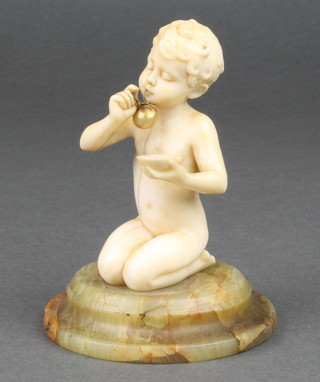 Ferdinand Preiss, a carved ivory figure of a kneeling naked child holding in one hand a bowl and in the other an opalescent bubble on stem, the circular onyx plinth inscribed F. Preiss 3 1/2"h