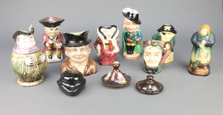 A collection of minor character jugs and figures
