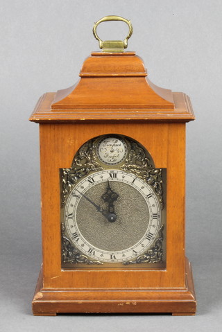 Rotherham, a Georgian style lancet bracket clock with 3 1/2" arched gilt dial and silvered chapter ring, contained in a mahogany case  