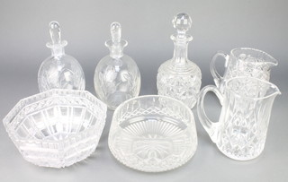 A pair of bulbous spirit decanters and stoppers with floral decoration 9 1/2", a decanter, 2 jugs and 2 bowls 