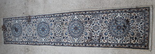 A Persian white and blue ground Nain runner 152" x 31" 
