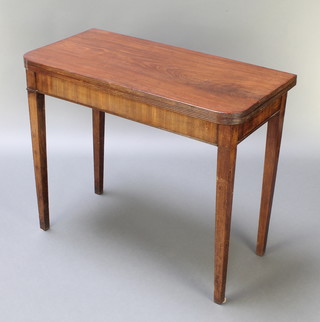 A 19th Century mahogany D shaped folding tea table, raised on square tapered supports 29 1/2"h x 36"w x 17 1/2"d 