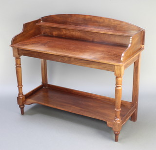 A Victorian mahogany wash stand with three-quarter gallery and undertier, raised on turned supports 38"h x 44"w x 20"d 