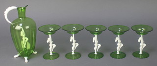 An art deco Bimini Werkstatte green glass cocktail set designed by Fritz Lampl comprising jug and 5 glasses, the jug having an internal white glass figure of a lady, the glasses with similar stems