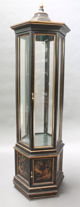 A chinoiserie style hexagonal black lacquered display cabinet enclosed by panelled doors 71"h x 24" diam. 
