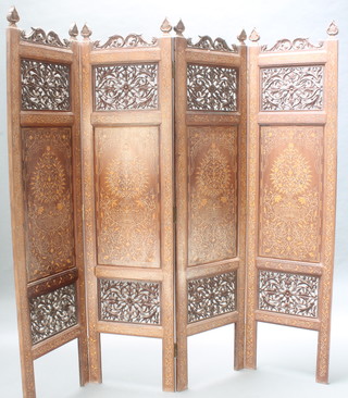 A pierced Eastern and inlaid hardwood 4 fold screen 72h  x 18" when closed x 72" when open 