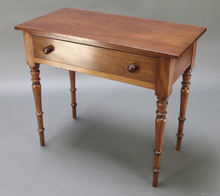 A Victorian rectangular mahogany side table fitted a frieze drawer, raised on turned supports 29" 1/2" x 34 1/2"w x 18"d 