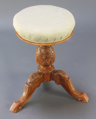 A Victorian carved oak adjustable piano stool (f) 