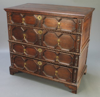 An oak Jacobean chest of 4 long drawers with geometric mouldings, pear drop handles, raised on bracket feet 37"h x 40"w x 21"d 