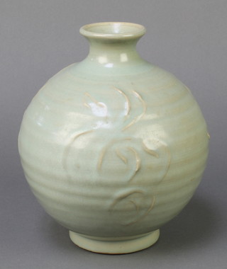 A studio pottery green glazed baluster vase 7 1/2"