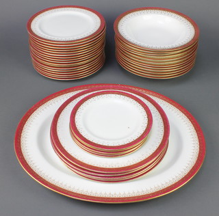 A Royal Doulton part dinner service with gilt borders comprising 5 small plates, 5 medium plates, 17 dinner plates, 12 soup bowls and 1 oval meat plate