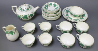 A Wedgwood Napoleon ivy tea service comprising 4 small tea cups, 4 large tea cups, 4 small saucers, 4 large saucers, 6 small plates, 1 medium plate, 2 large plates, teapot, milk jug and sugar bowl 