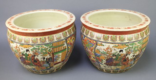 A pair of modern Japanese Satsuma jardinieres decorated with figures before pavilions, the interior with carp 11" 