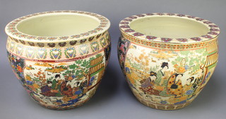 A pair of modern Japanese Satsuma jardinieres decorated in pavilions the interior with carp 13" 