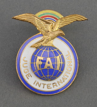 From the estate of Captain Eric M Brown 2 French gilt metal and enamelled Federation Aeronautique International lapel badges ,a Soviet Russian gilt metal enamelled lapel pin decorated an MN26 helicopter, a gilt metal and enamelled CCP pin marked UAK and 1 other marked 0AC