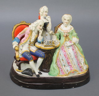 A 19th Century Continental bisque group of chess players, the base with night light holders 8" 