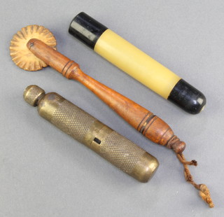 A 19th Century turned wooden pastry crimper 5", an Art Deco chrome and Bakelite manicure set and a pocket screwdriver