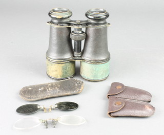 A pair of 19th Century binoculars, some leather is missing and 2 pairs of pince nez 