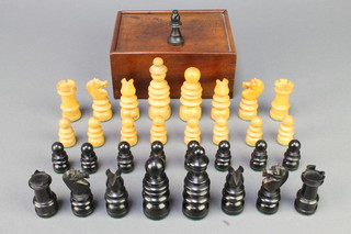 A Victorian St Georges Patent carved wooden chess set, complete with 1 additional black bishop 
