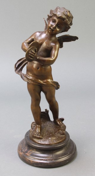 A bronze figure of a standing cherub with cymbal raised on a black marble base 12" 