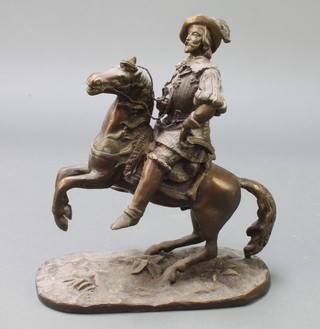 A bronze figure of a Cavalier on a horse, raised on an oval base 11" 