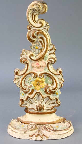 A Victorian painted cast iron door stop with floral decoration 12" x 3" 