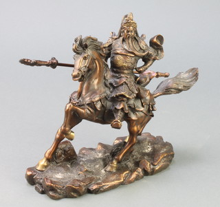 An amber coloured metal figure of a mounted Chinese warrior, raised on an oval base 9 1/2" 