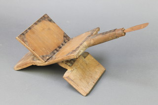 A wooden and metal coconut grater 17 1/2" x 6" 