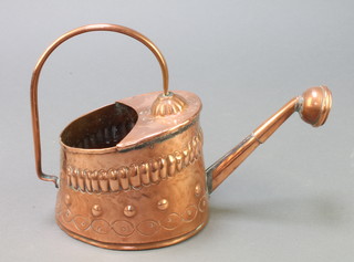 An oval Newlyn style embossed copper watering can 