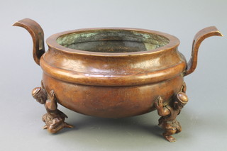 A Chinese circular twin handled censer supported by 3 crouching figures 7"h x 10" diam. 