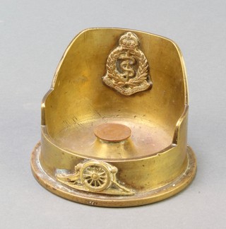 A Trench Art ashtray formed from a shell case with Army Medical Corps cap badge 