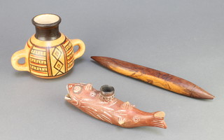 An "Aboriginal" bullet shaped section of carved wood 10", a terracotta model of a fish 7" (chipped to tail) and a Chilean twin handled vase 4" 