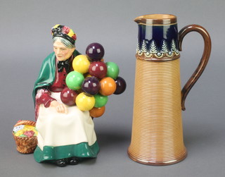 A Royal Doulton figure - The Old Balloon Seller HN1315 7 1/2", a ditto vase of tapered form with ribbed body 8" 