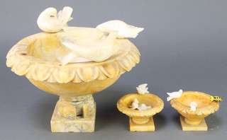 A 1930's circular carved alabaster bowl decorated 3 doves 6" x 9 1/2" (1 tail f) and 2 small ditto decorated birds amidst trees 