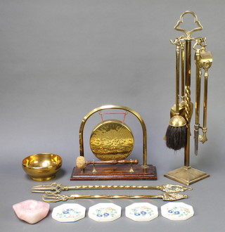 A brass 4 piece fireside companion set, a circular brass bowl 5", a brass tea gong, 2 brass pokers, a harstone ashtray and 4 Aynsley octagonal coasters 