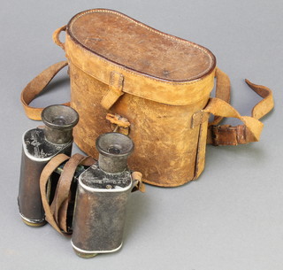 A pair of Trieder 9X binoculars with leather carrying case