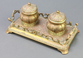 A Victorian pierced brass 2 bottle standish with 2 pierced melon shaped inkwells (no liners) raised on bun feet 4" x 11" x 6 1/2" 