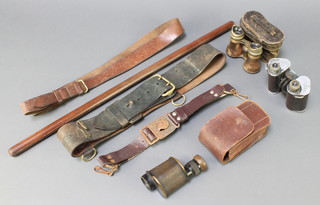 A Negretti and Zambra 6X minocular, a pair of Trieder binoculars X 50 (lens covers f), a pair of opera glasses with leather case, a leather Sam Browne belt, a swagger stick and a Girl Guide belt 